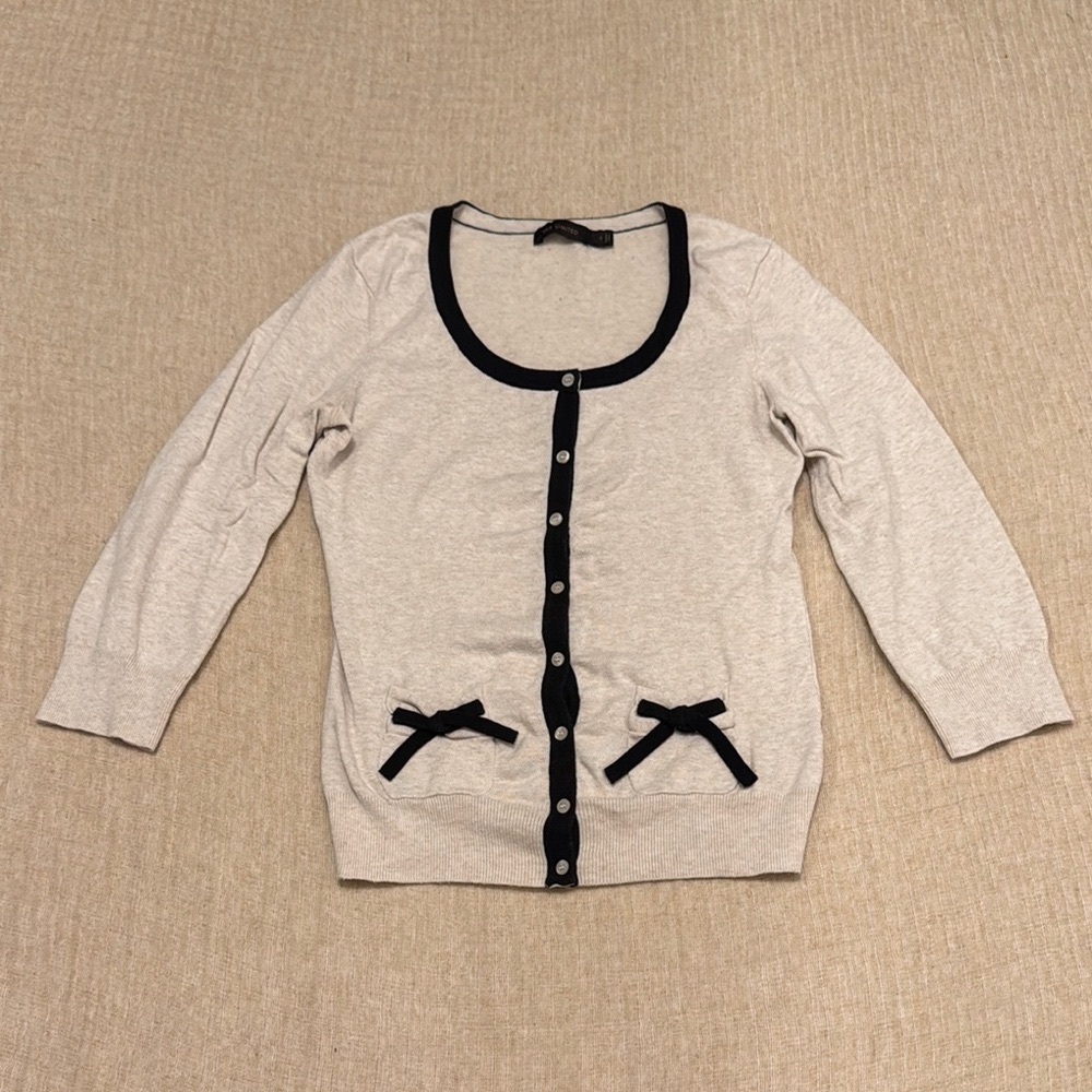 Cream Cardigan with Black Trim and Bow Accents